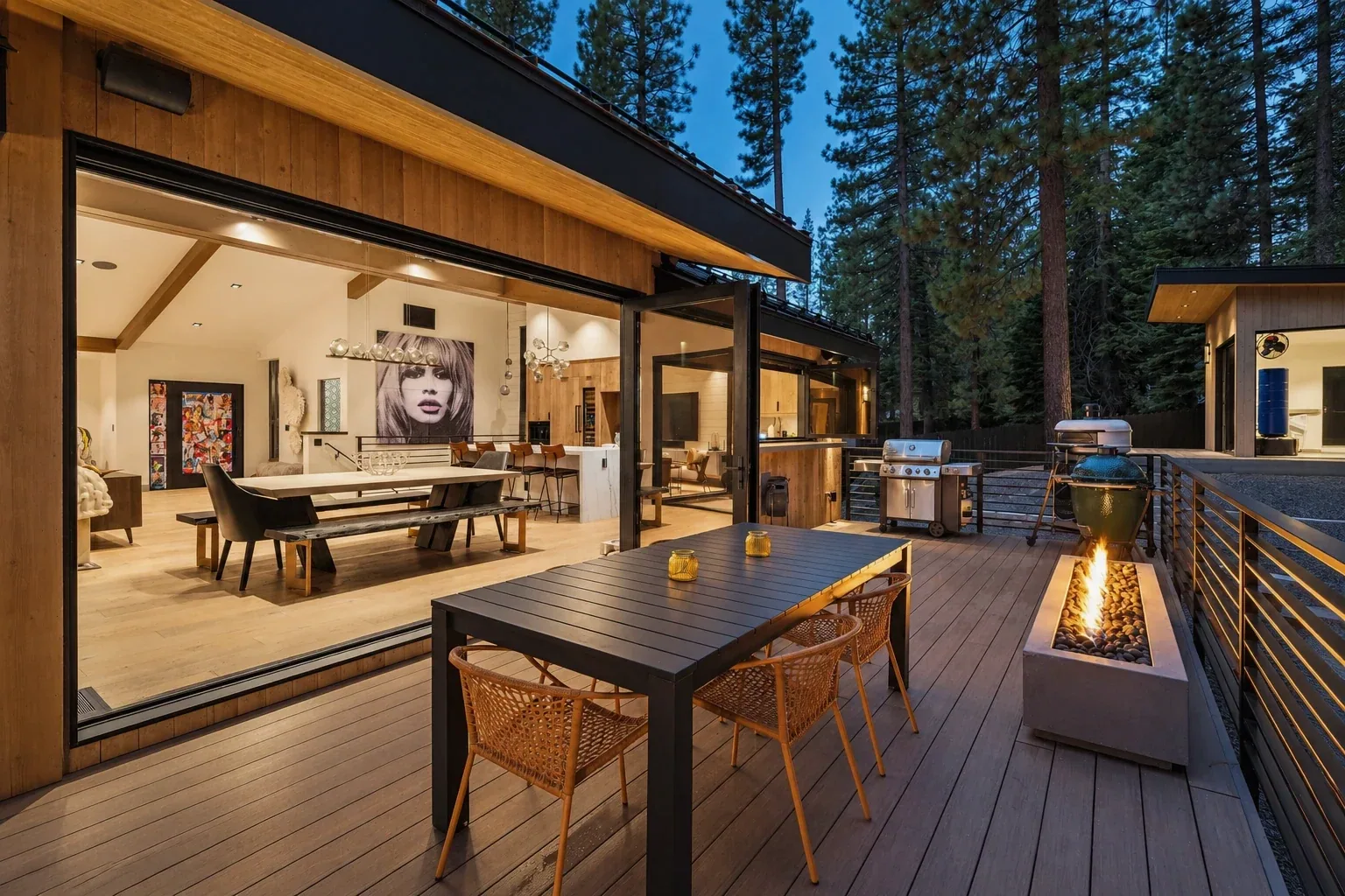 Original twilight deck and outdoor dining photograph with open glass doors